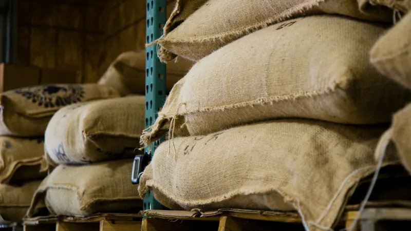 Jute sacks stacked on pallets in a warehouse